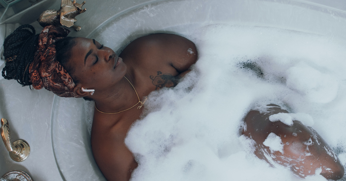 black woman, self-care, bubble bath, relaxed, health journey