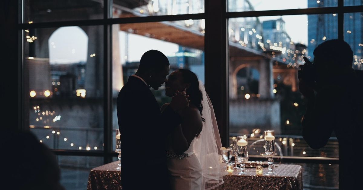 couple in love, wedding, black couple, black love, wedding ceremony, sharing a kiss, holding hands, love language