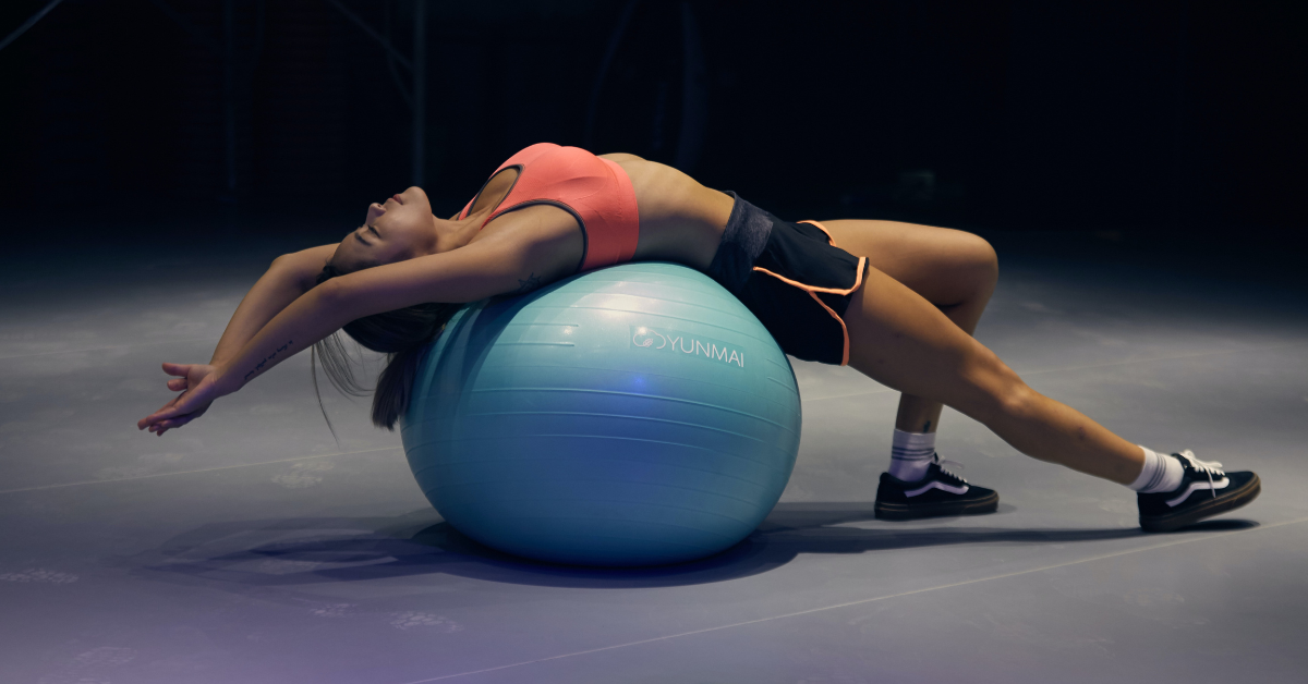 woman relaxing on an exercise ball