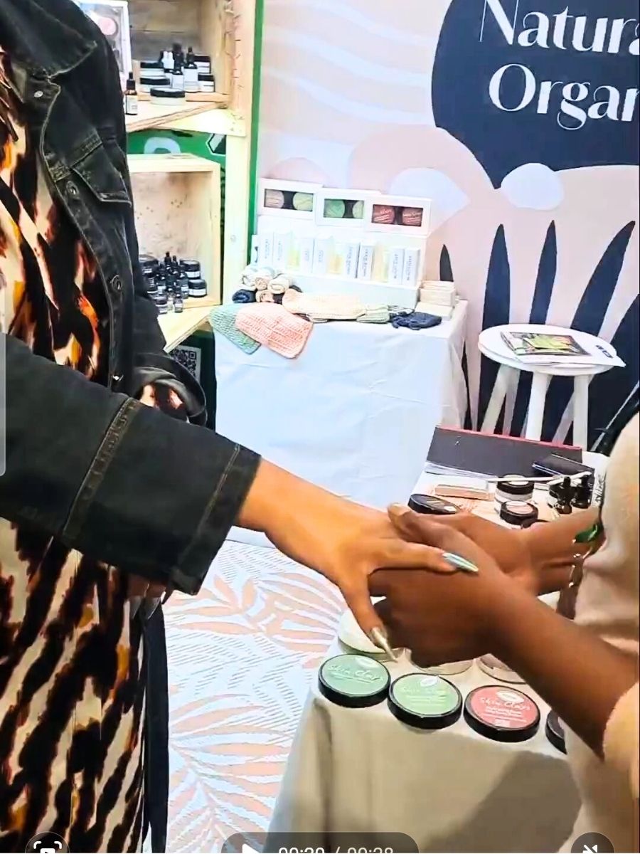 closeup of Elle Williams getting a hand massage with natural skincare products by skin clays
